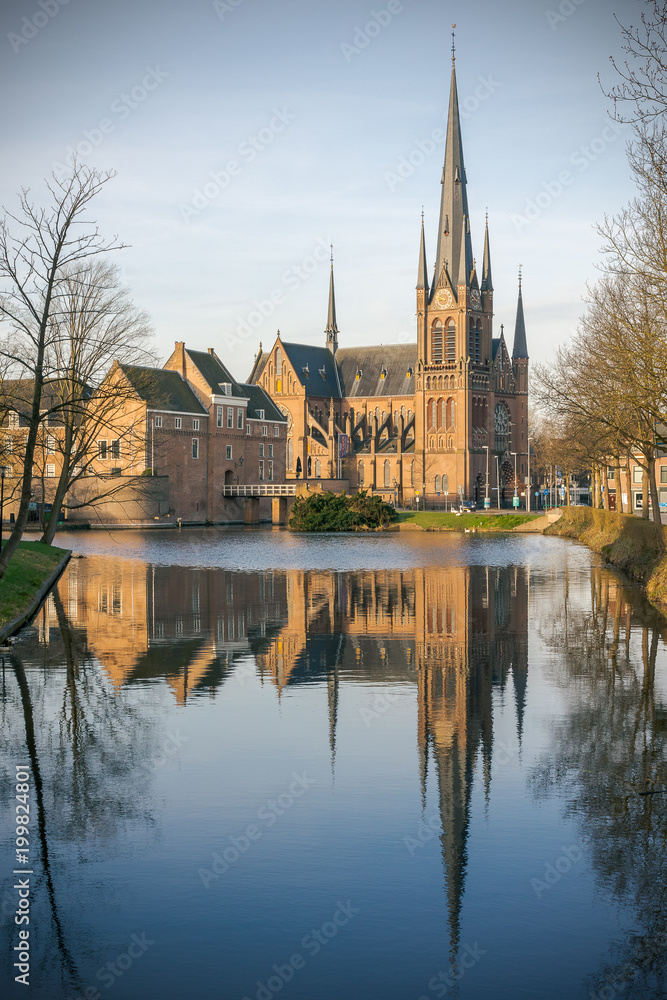 Bonaventura church and castle reflecting in a lake in Woerden, Utrecht, The Netherlands