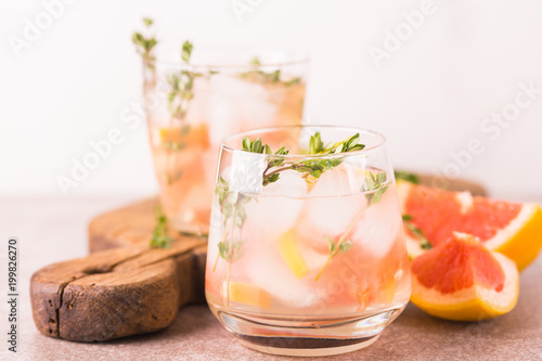 Gin bitter lemon with thyme and grapefruit. Fruit lemonade.