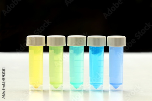 Sample tubes containing chemicals of differing colours. photo