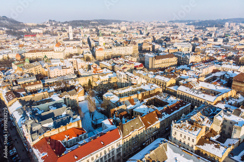bird's eye view of old european city in winter day on sunset © phpetrunina14
