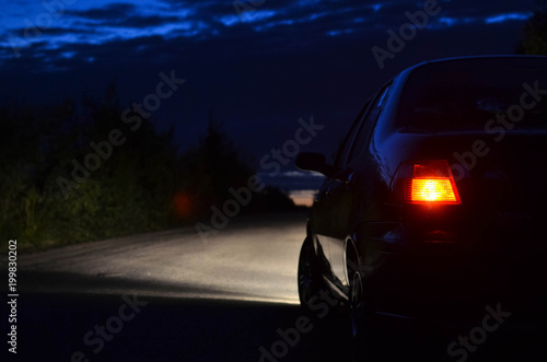 Car at night , rear view with blur effect