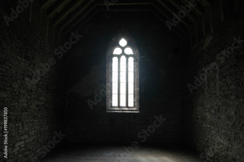 Generic church window with light streaming through