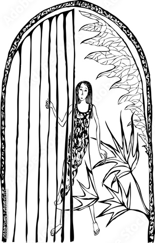 Lonely girl at the garden gate