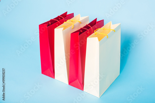 Paper shopping bags on blue background
