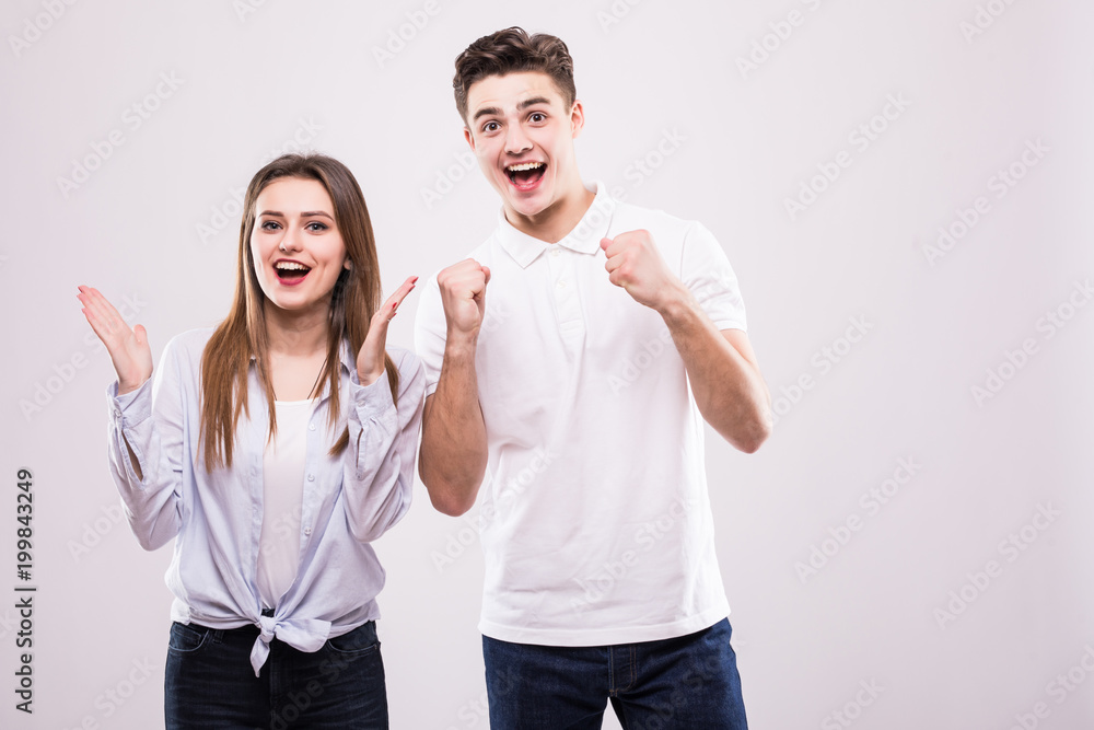 Portrait of beautiful young couple. Isolated on white background Portrait of beautiful young couple. Isolated on white background