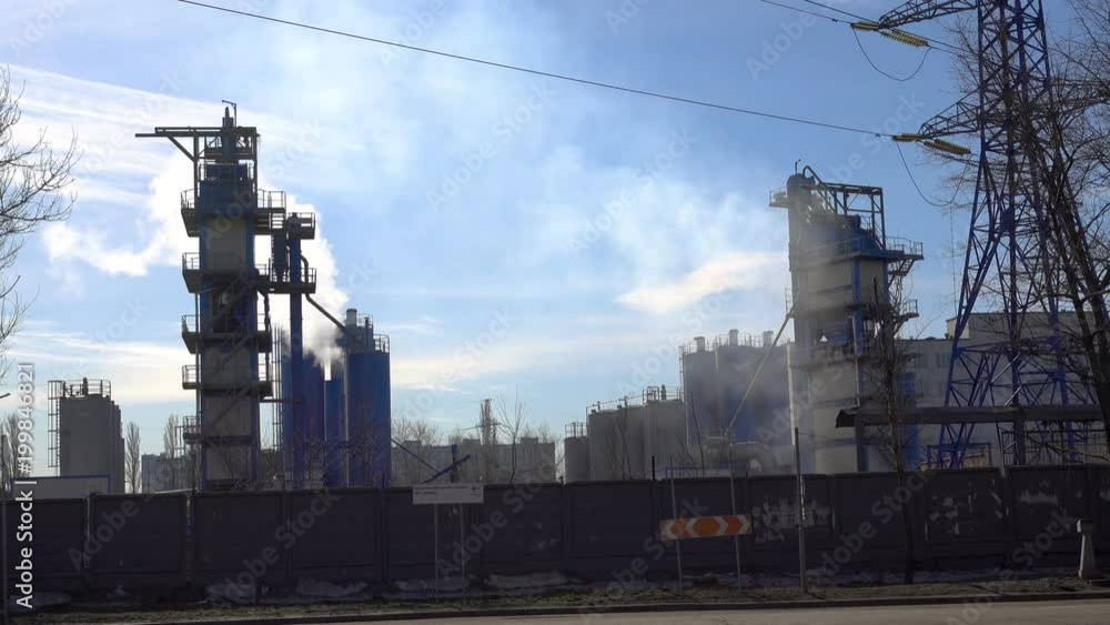 08 April 2018. Russia, Mocow. Smoking industrial chimneys. Smoking power plant. Plant, air emissions.White smoke against sun. Editorial. Street vagoregnotnaya. 08 April 2018. Russia, Mocow. Smoking industrial chimneys. Smoking power plant. Plant, air emissions.White smoke against sun. Editorial. Street vagoregnotnaya.