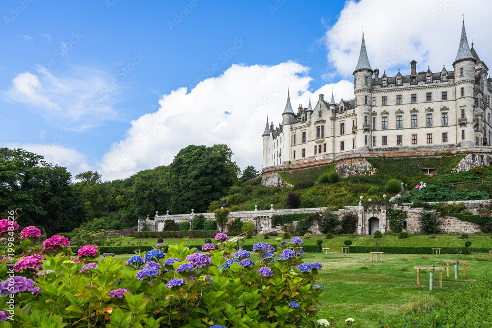 Fairytale view of Dunrobin Castle, with a magnificent garden full of flowers, Sutherland, Scotland, Britain