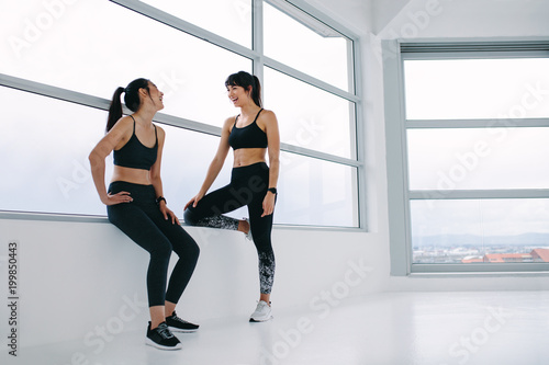 Female friends talking after fitness training