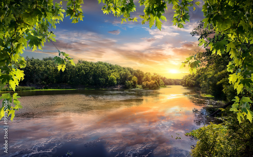 Fototapeta Naklejka Na Ścianę i Meble -  Reflection of sunset in river
