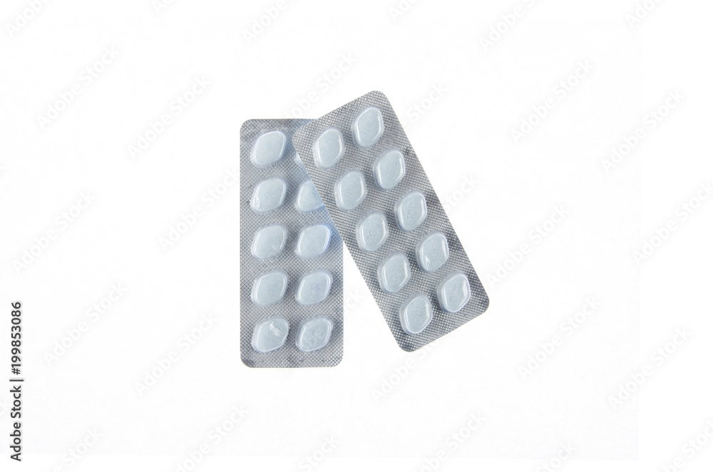 two plates of blue pills on white isolated background two plates of blue pills on white isolated background