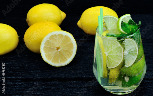 glass of water with lemon and lime