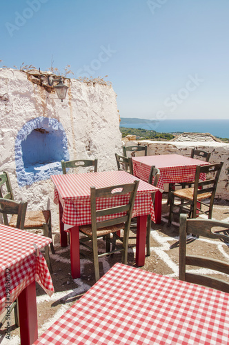 Traditional Greek taverna at the old village Alonissos at Alonissos island in Greece
