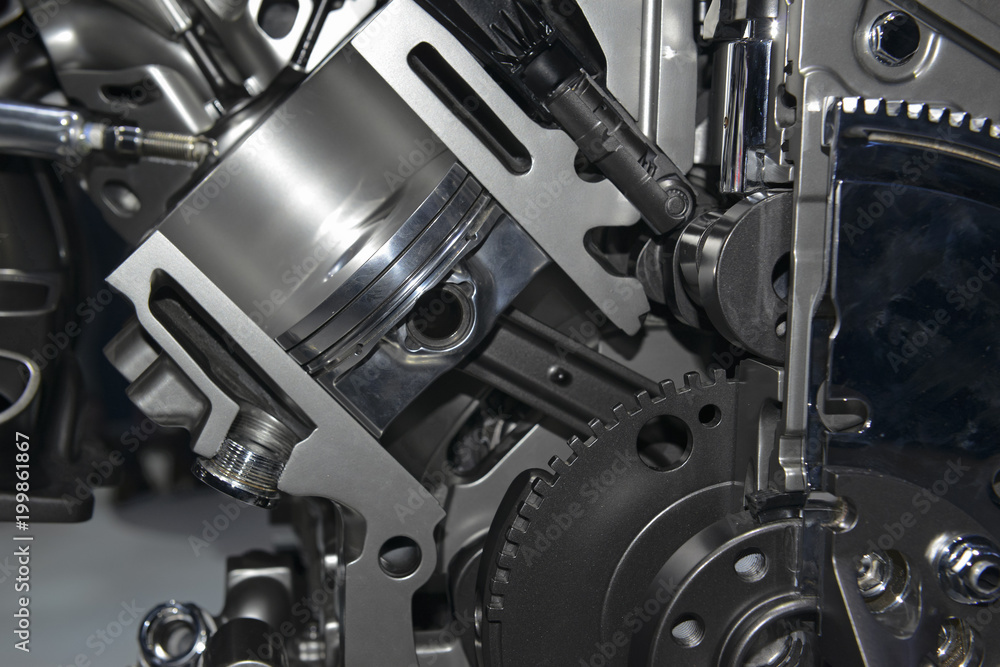 Close up detail of modern powerful automobile internal combustion engine which burns cleaner and is more environmentally friendly than older engines Close up detail of modern powerful automobile internal combustion engine which burns cleaner and is more environmentally friendly than older engines