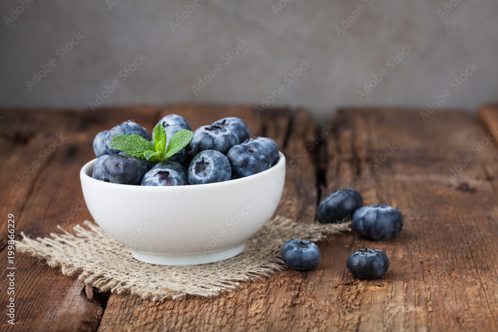 Blueberry on wooden table background. Ripe and juicy fresh picked blueberries closeup. Berries closeup with copy space Blueberry on wooden table background. Ripe and juicy fresh picked blueberries closeup. Berries closeup with copy space