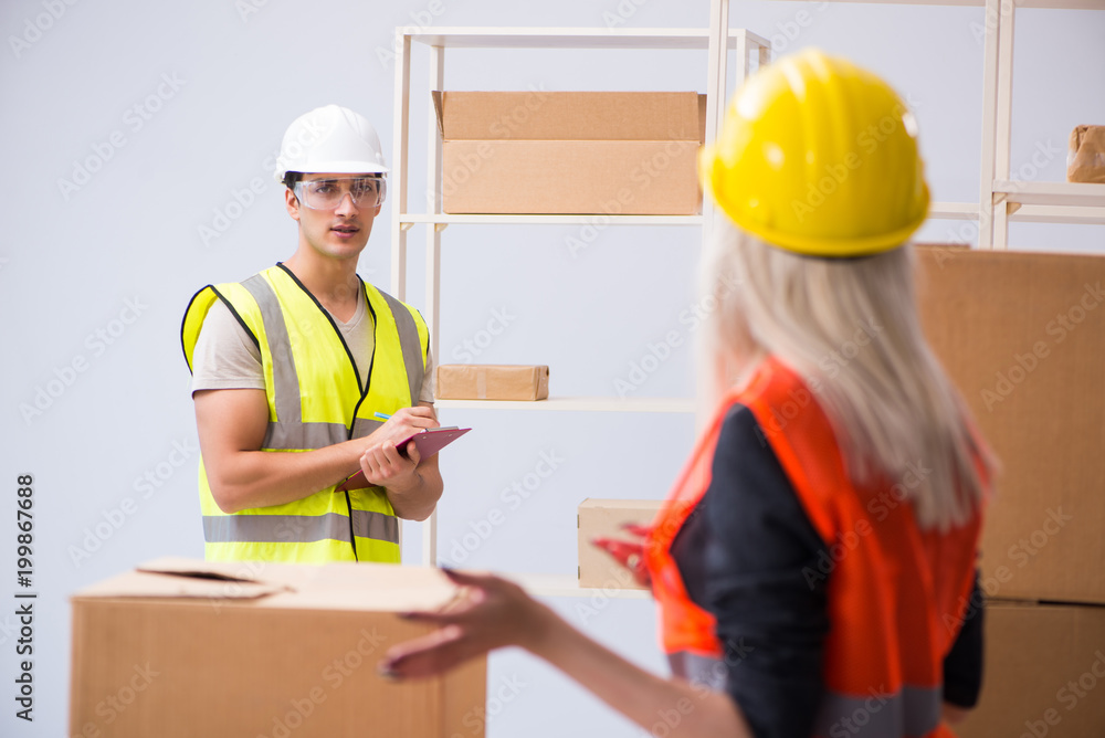 Delivery contractor delivering boxes to office Delivery contractor delivering boxes to office