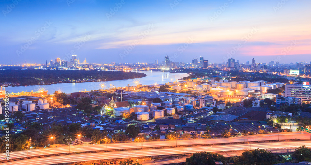 Chao Phraya River, Bangkok port and Bangkok skyline at twilight.