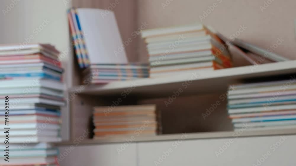 Pile of books on the floor and on the shelfs closet. Blur. Pile of books on the floor and on the shelfs closet. Blur.