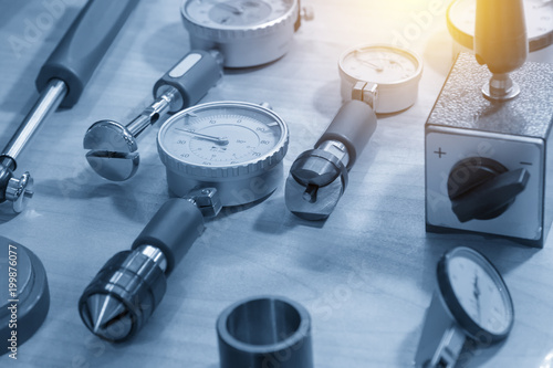 Papier peint The  dial gauge for industrial measuring purpose in the light blue scene