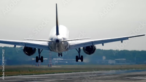 Widebody airplane landing at morning photo