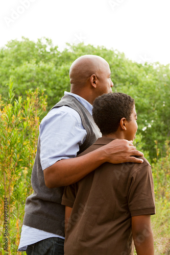 Father comforting his son.