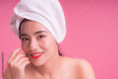 Beautiful Young asian Woman face portrait, Isolated on pink background