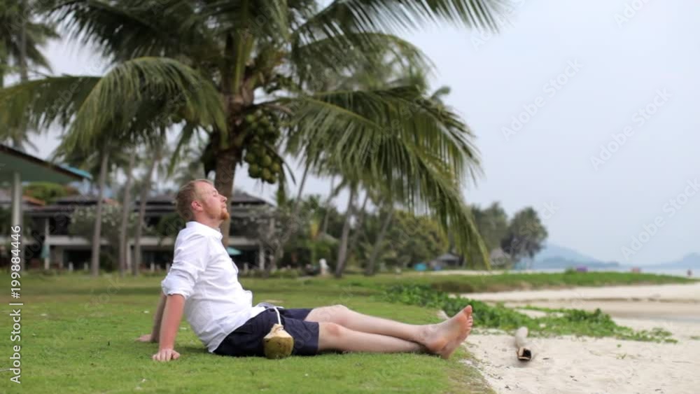businessman is relaxing on the beach businessman is relaxing on the beach