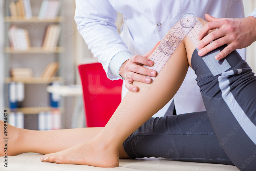 Doctor checking patients joint flexibility