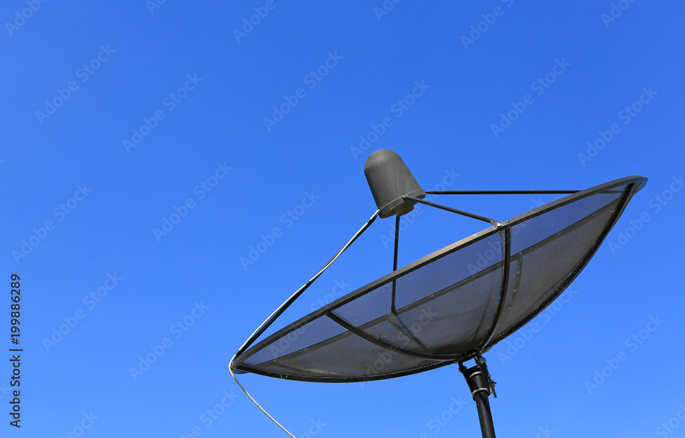 Satellite communication disk on blue sky background.