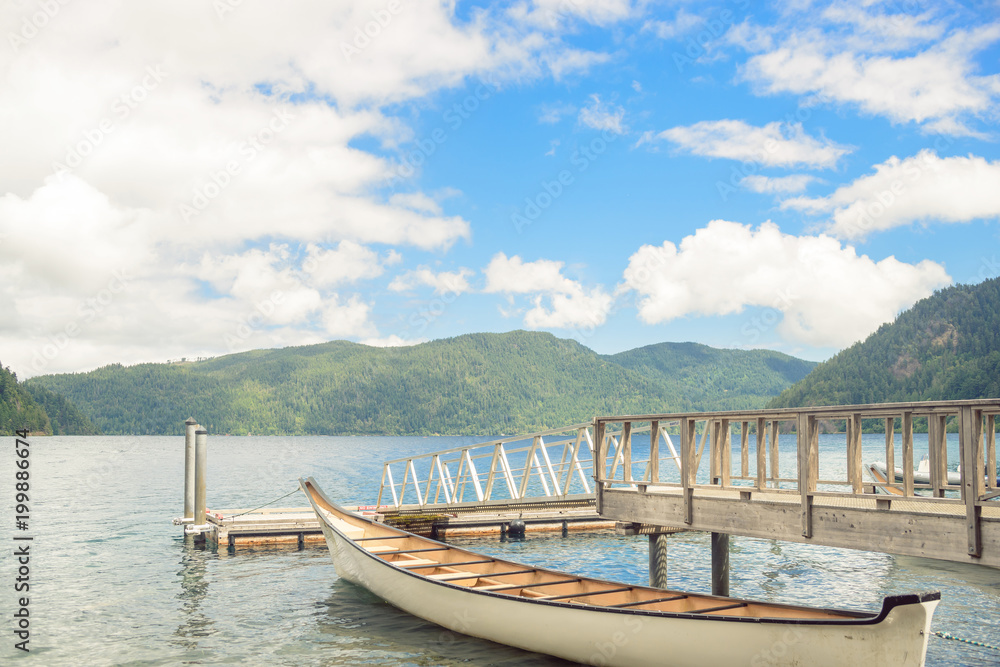 Wooden boat pier on mountain lake