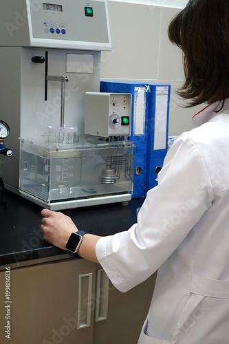 Wallpaper Mural A working day in chemical laboratory: a assistant prepares samples for analysis Torontodigital.ca