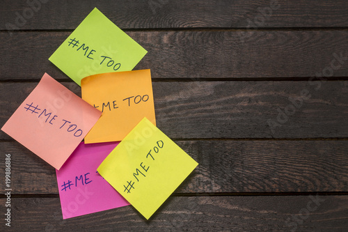 Me Too hashtag on a adhesive note posted