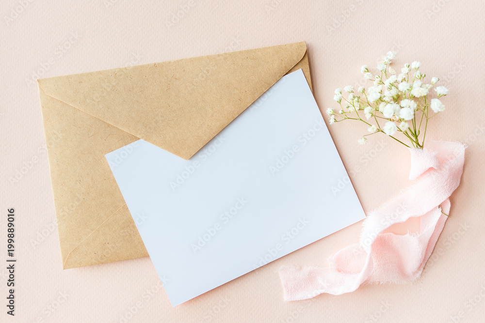 A letter on a pink background with Gypsophila with silk ribbon, invitation for a wedding, a text card and an envelope A letter on a pink background with Gypsophila with silk ribbon, invitation for a wedding, a text card and an envelope