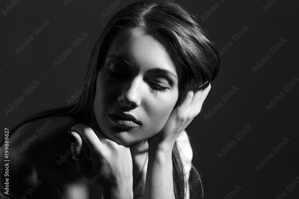Fototapeta Black and white portrait of beautiful woman with natural look and without makeup.