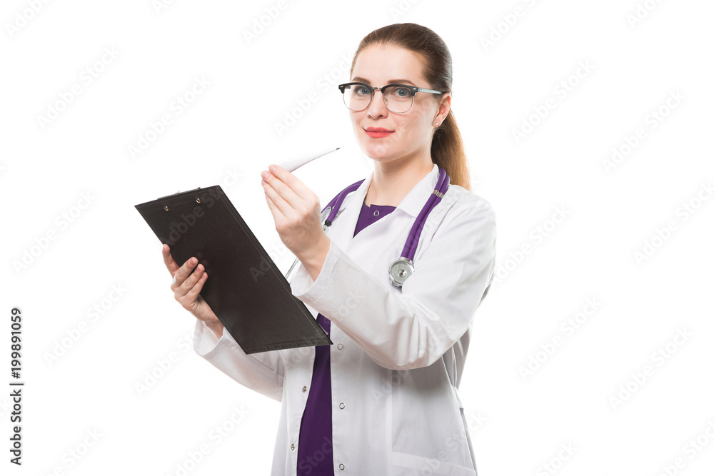 Attractive caucasian brunette female doctor standing in office with thermometer and clipboard in her hands on white background Attractive caucasian brunette female doctor standing in office with thermometer and clipboard in her hands on white background