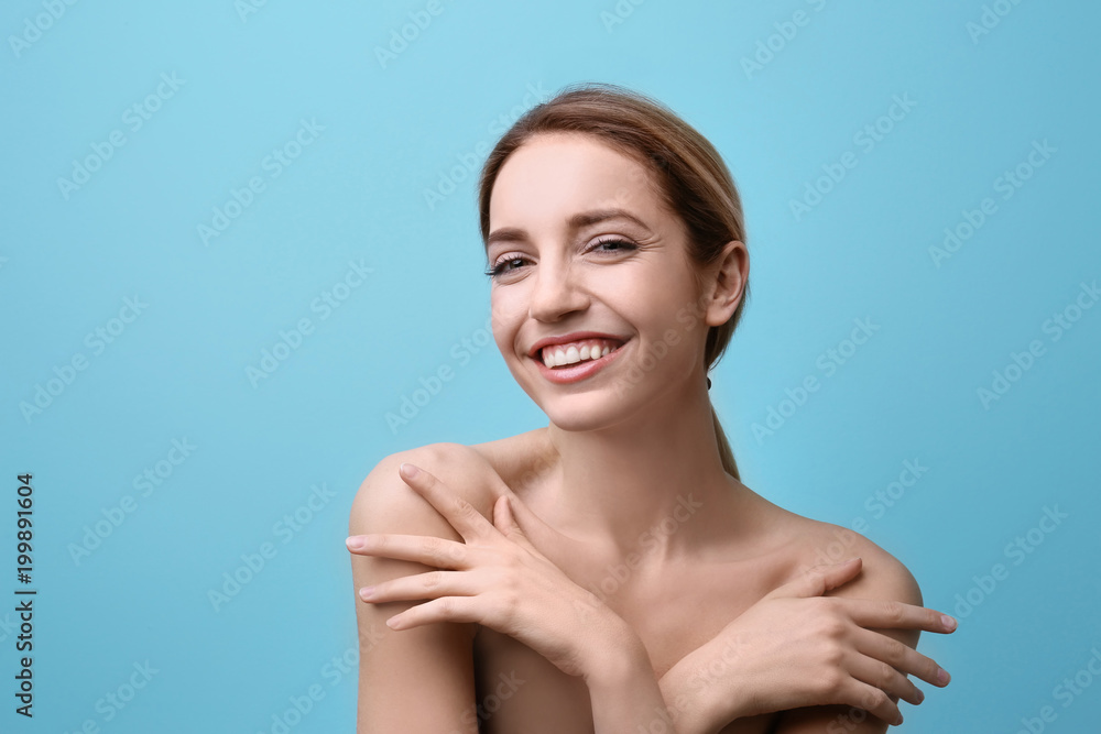 Beautiful young woman with silky skin on color background Beautiful young woman with silky skin on color background