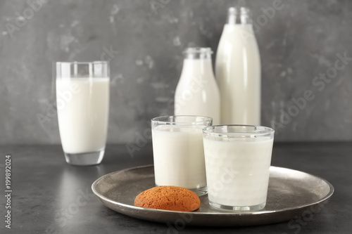 Glassware with milk on table. Fresh dairy product