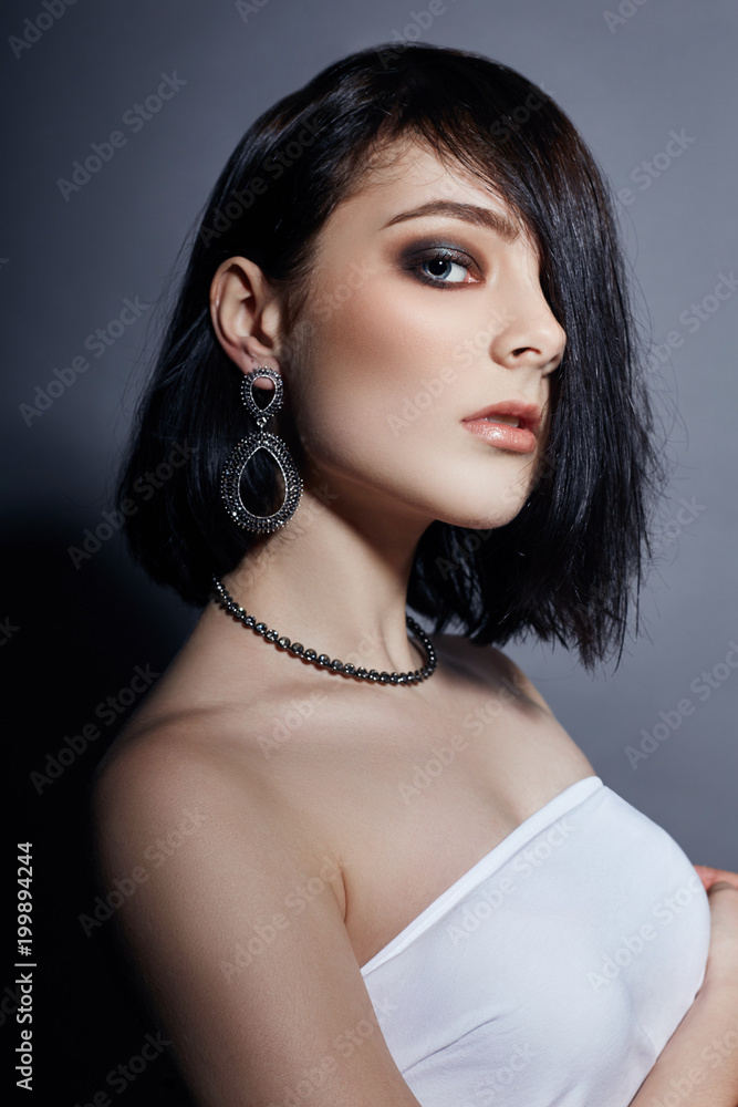 Portrait of a sexy brunette woman with big - Stock Photo