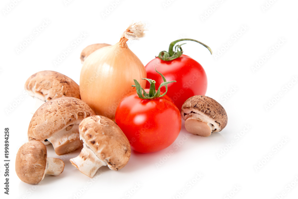 Group of champignon mushrooms, onions, tomato on a white background. A set of fresh vegetables for the filling of vegetarian pizza. Group of champignon mushrooms, onions, tomato on a white background. A set of fresh vegetables for the filling of vegetarian pizza.