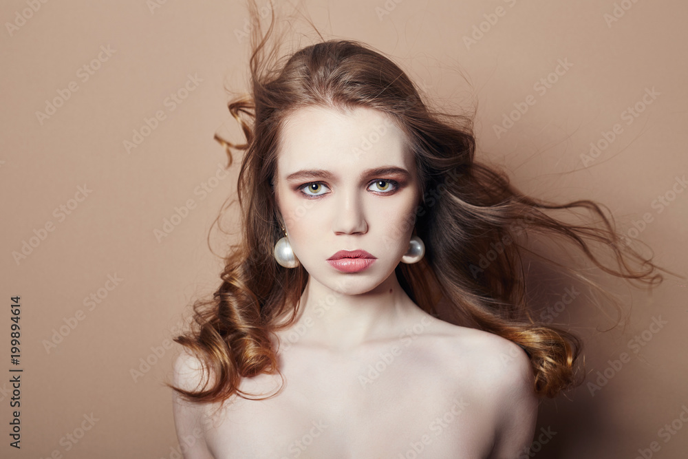 Naklejka premium Sexy young blonde girl hair jewelry on her neck and earrings in her ears, beautiful eyes. Summer skin care eye shadow, fashion natural skin care, face skin art, body beauty nature, spring makeup
