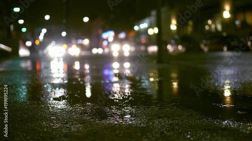 Rainy evening with traffic in urban city area - suspense style filler shot