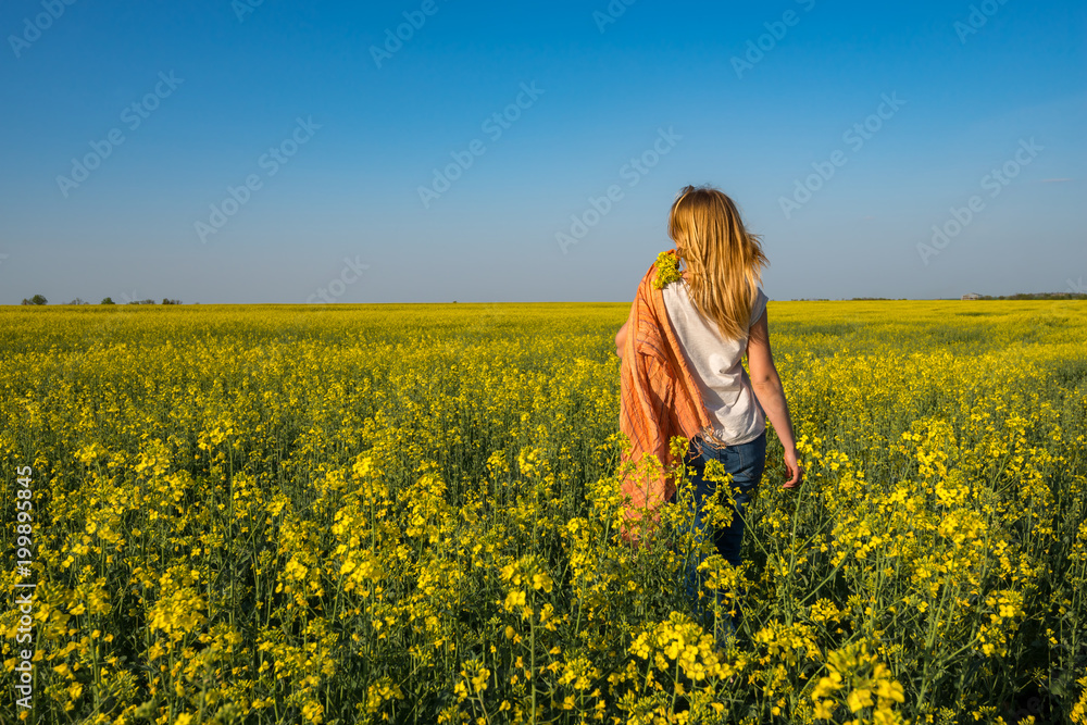 Young beautiful woman blonde, with orange scarf Young beautiful woman blonde, with orange scarf