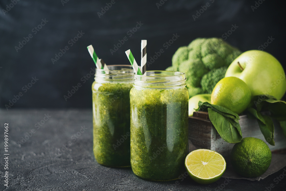 Green smoothie with ingredients, apples, lime, broccoli and spinach in box. Green smoothie with ingredients, apples, lime, broccoli and spinach in box.