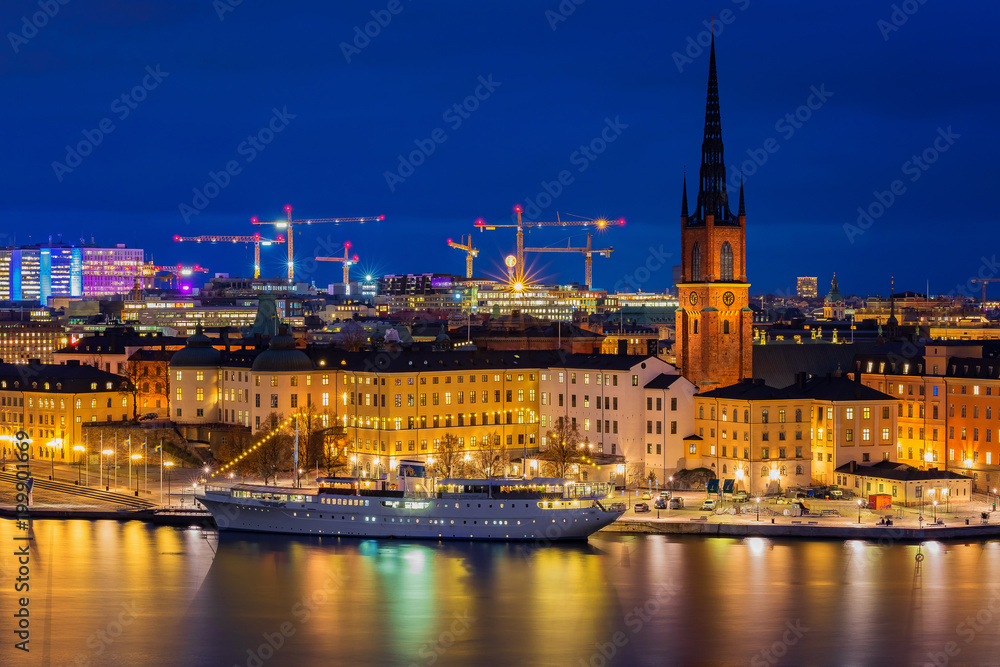 Twilight view onto Stockholm old town Gamla Stan and Riddarholmen church in Sweden