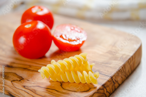 cherry tomatoes on wooden stong