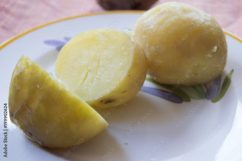 peeled boiled potato cut half