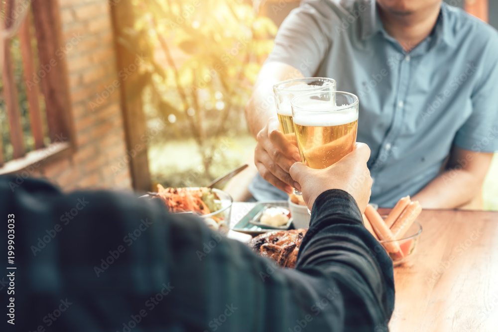 Close up of hand adult man holding beer glass and clinking together. Close up of hand adult man holding beer glass and clinking together.