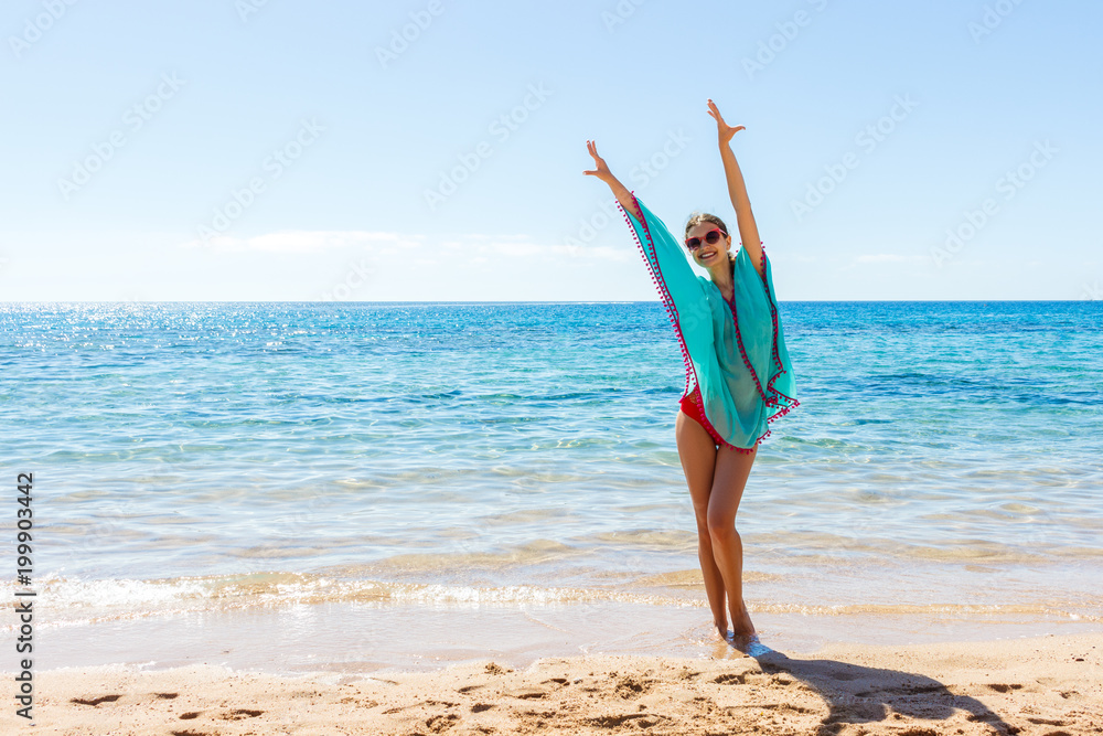 young beautiful blonde girl in glasses having fun on the beach young beautiful blonde girl in glasses having fun on the beach
