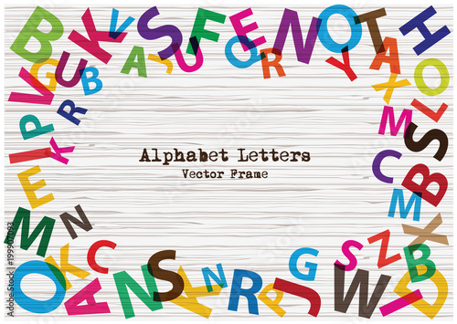 Set of bright rainbow alphabet letters on textured wooden background. Cartoon vector frame of colorful alphabet letters.