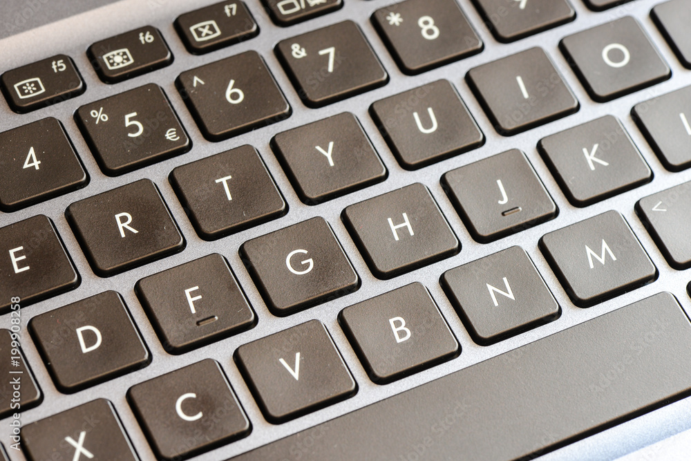Closeup of laptop keyboard buttons with symbols Closeup of laptop keyboard buttons with symbols