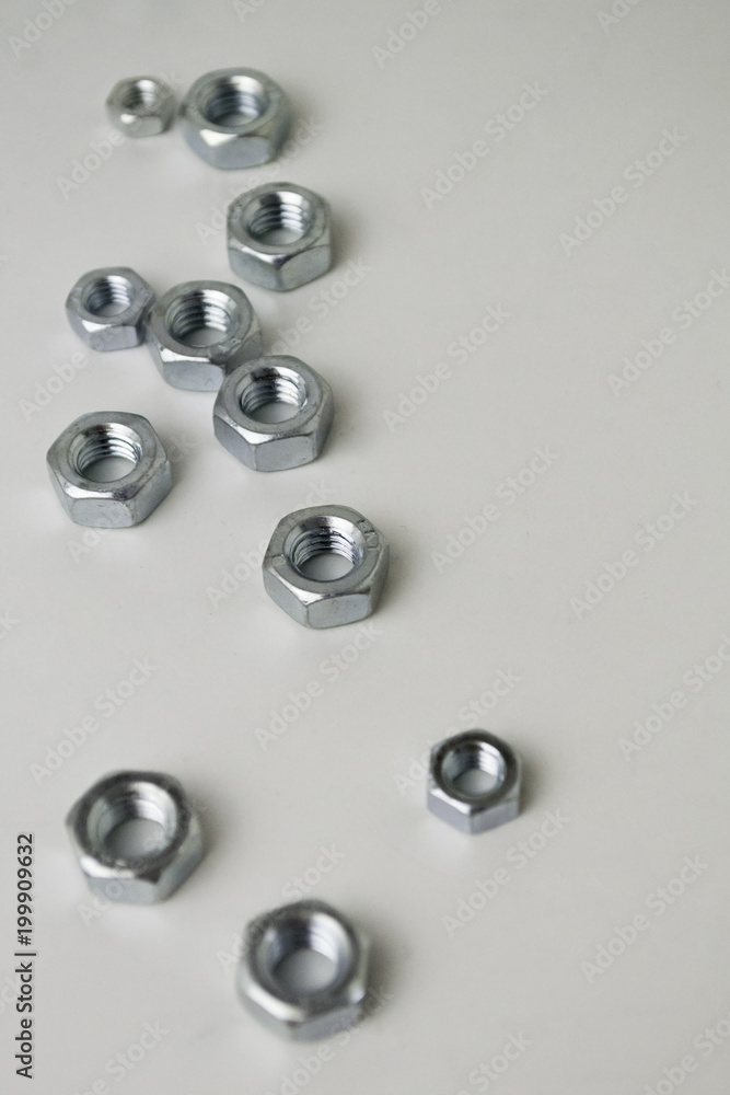 Nuts and bults metallic with white background Nuts and bults metallic with white background